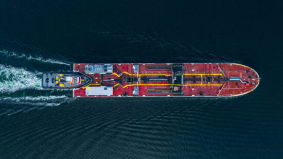Aerial,View,Of,A,Tug,Boat,Pushing,A,Barge,Carrying